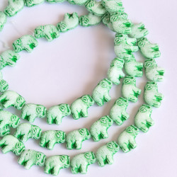 White elephants with green...